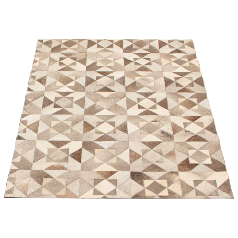 Tapis gris / ivoire / brun en cuir de vache fabriqué à la main Louden