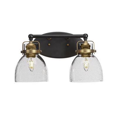 Barre d'éclairage de salle de bain 2 lumières Carmel, fini noir mat et laiton avec verre transparent de 6 po