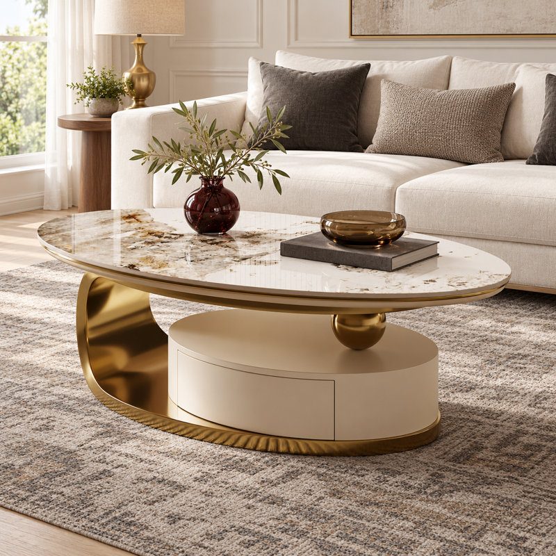 Table basse ovale moderne 51 po Labana, plateau en pierre frittée, pieds dorés, tiroir