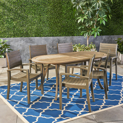 Eligha 6 - Person Acacia Solid Wood Patio Dining Set Oval Table