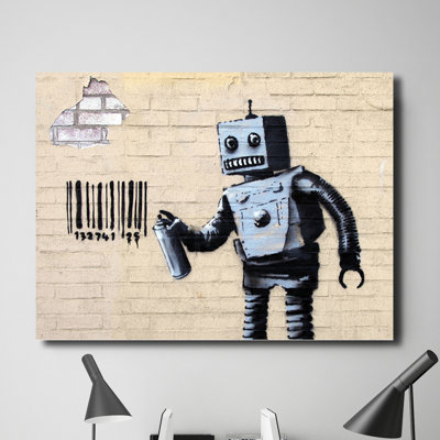 Robot Tagging by Banksy - Wrapped Canvas Print