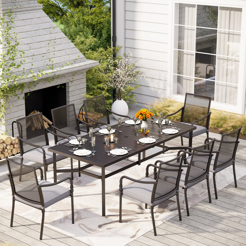Nameer 8 - Person Patio Dining Set with Rectangular Table , Cushions Included