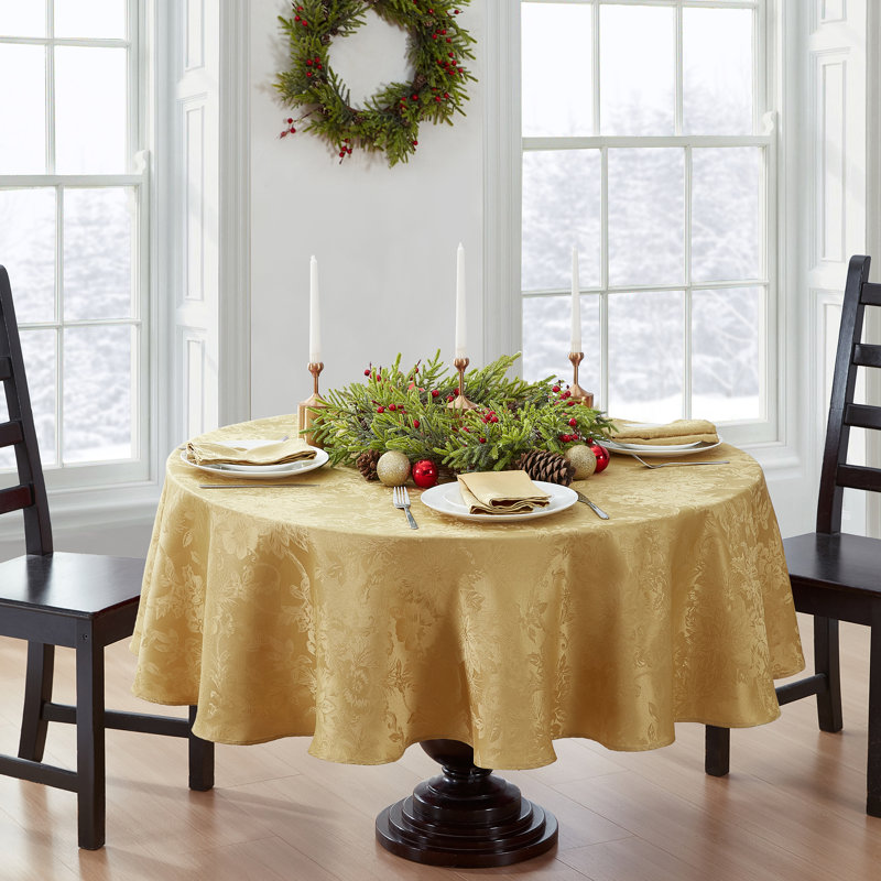 Tilghman Poinsettia Floral Woven Tablecloth, Gold, 70" Round
