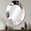 Miroir mural ovale rose sur fond texturé rose et noir I-293986125