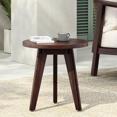 Table d'appoint ronde Marina, fabriquée à la main en bois avec trois pieds en saillie, d'une profondeur de 15,84 pouces, de couleur brun foncé, idéale pour la chambre à coucher ou le salon.