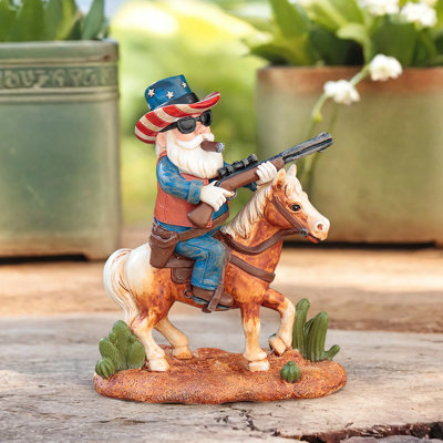 A Dwarf Fignail In The Shape Of A Western Cowboy Riding A Horse With A Gun