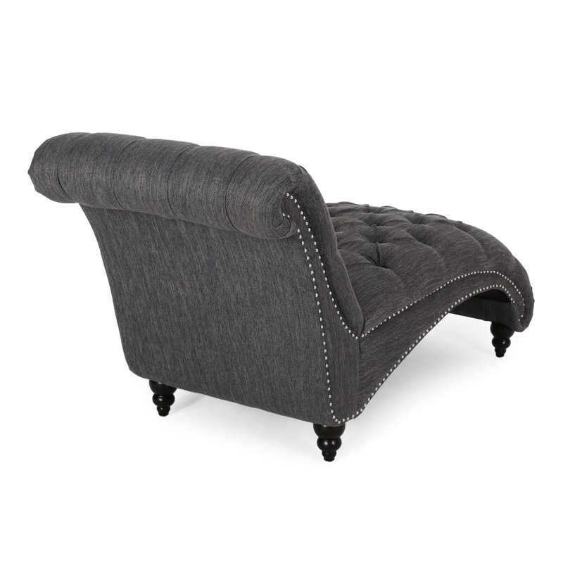 Chaise longue avec motif courbé et capitonnage à boutons, coutures en losanges, revêtement en tissu gris anthracite, capitonnage aux pieds en bois de bouleau et forme confortable, tissu