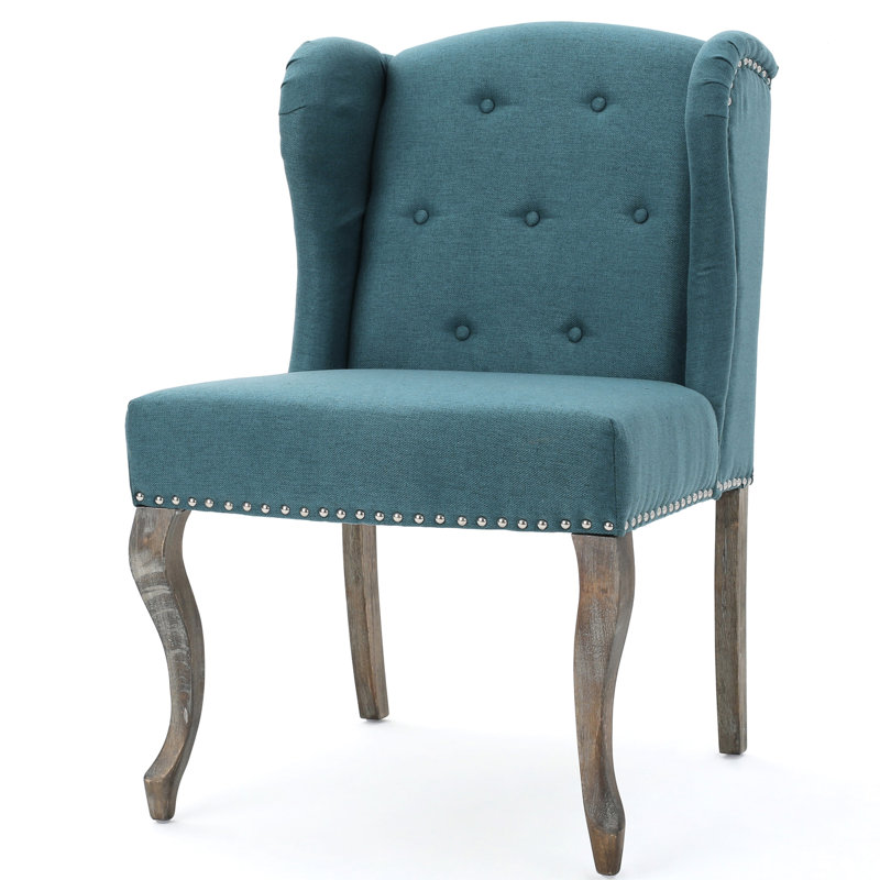 Élégant fauteuil à oreilles bleu sarcelle avec pieds et capitonnage