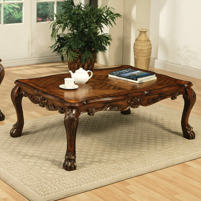 Table basse en chêne cerisier de style rétro avec pieds griffes et plateau de table