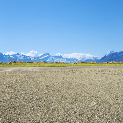 Empty Rural Road Near Snow Mountains In New Zealand by Zhudifeng - Wrapped Canvas Print