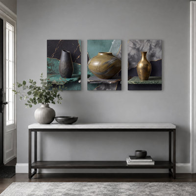 Ensemble de 3 vases en céramique noirs et dorés sur des tablettes en pierre