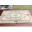 Tapis turc rétro de style floral pastel avec des tons de rose et de bleu clair pour une décoration intérieure élégante