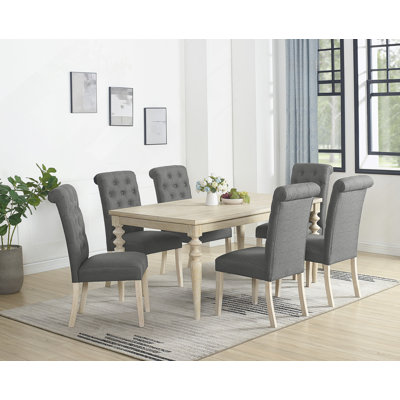 Ensemble de salle à manger 7 pièces à pieds tournés avec 6 chaises capitonnées