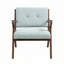 Fauteuil en tissu vert clair avec pieds en bois