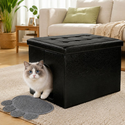 Ce grand pouf-banc noir en forme de L, dissimulant une litière, combine le contrôle des odeurs avec une conception de meuble à l'épreuve des chiens, un intérieur imperméable, des surfaces faciles à nettoyer et un assemblage simple.