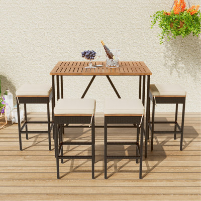 Abrionna 4 - Person Patio Dining Set with Rectangular Table , Cushions Included
