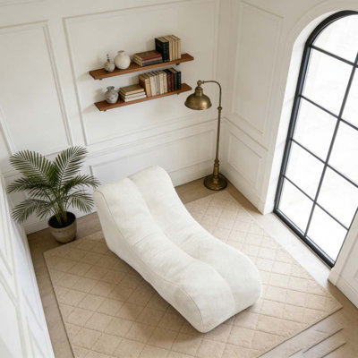 Soft beanbag chair with high resilience foam core for two people.