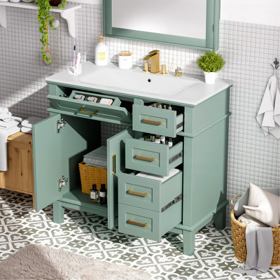 Meuble-lavabo moderne vert clair de 36 po avec lavabo en céramique, porte à fermeture en douceur et 4 tiroirs de rangement, offrant un look raffiné avec une fonctionnalité pratique au quotidien.