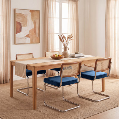 Walton Cantilevered metal dining chairs with rattan back