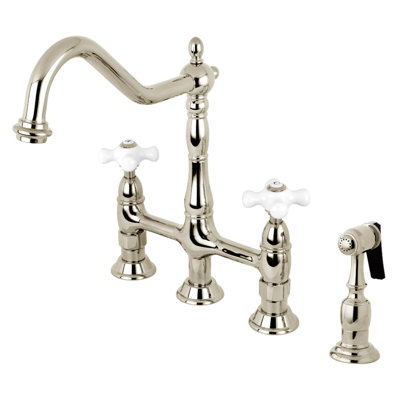 Kingston Brass Heritage Two-Handle 4-Hole Deck Mount Bridge Kitchen Faucet with Brass Side Sprayer