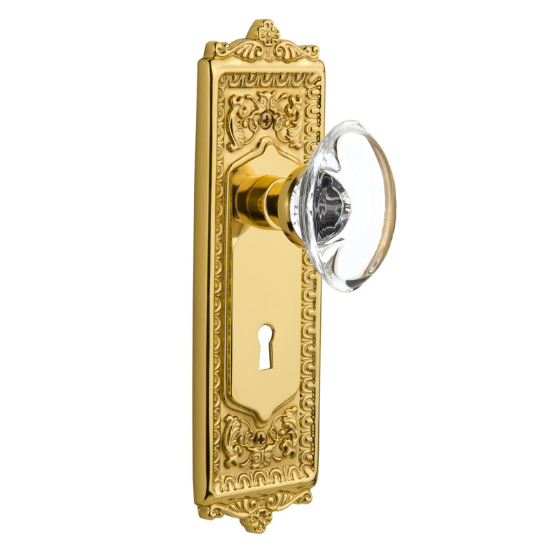 Egg & Dart Plate with Decorative Keyhole and Oval Clear Crystal Door Knob, Unlacquered Brass