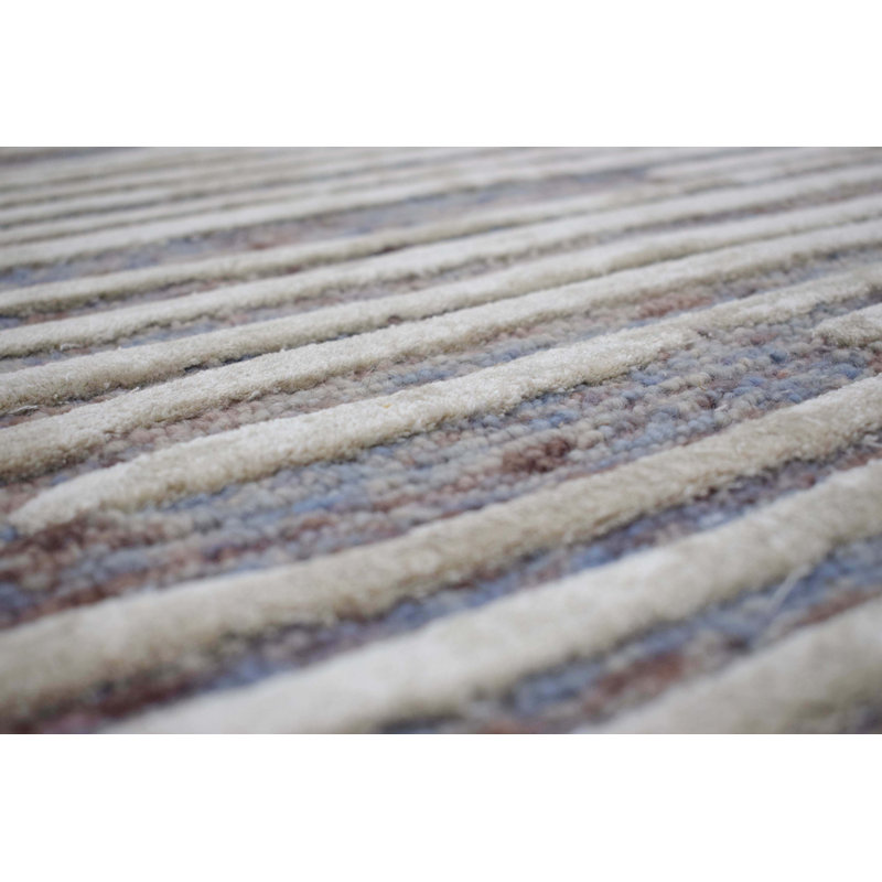 Tapis bleu ciel/ivoire à la main