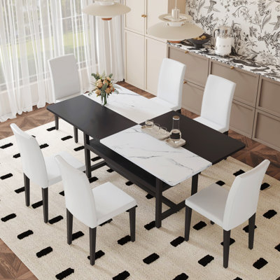 Table And Chair Set.71*35.4 Inch White And Black Spliced Dining Table With Storage Function In The Middle Of The Table Legs.Paired With 6 White PU Dining Chairs, Simple And Versatile.