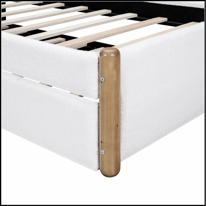 Lit plateforme tapissier avec pieds de soutien en bois et lit gigogne, durable et peu encombrant pour les chambres à coucher modernes.