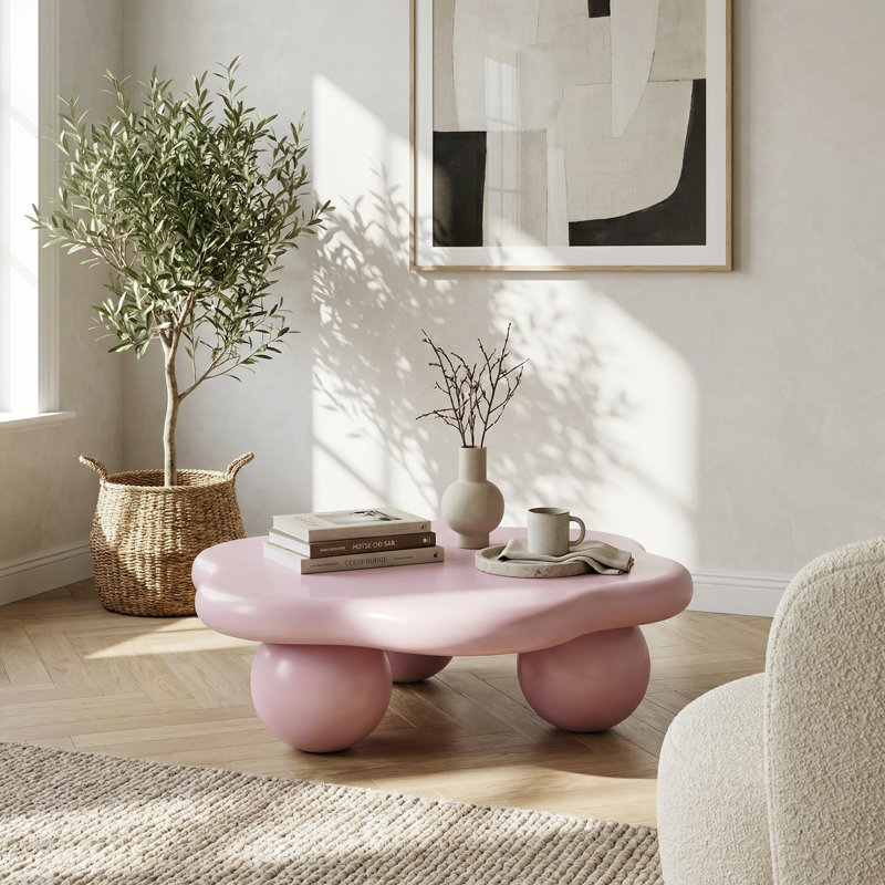 Table basse moderne en forme de nuage avec pieds sphériques au fini rose doux pour les salons et les espaces pour enfants