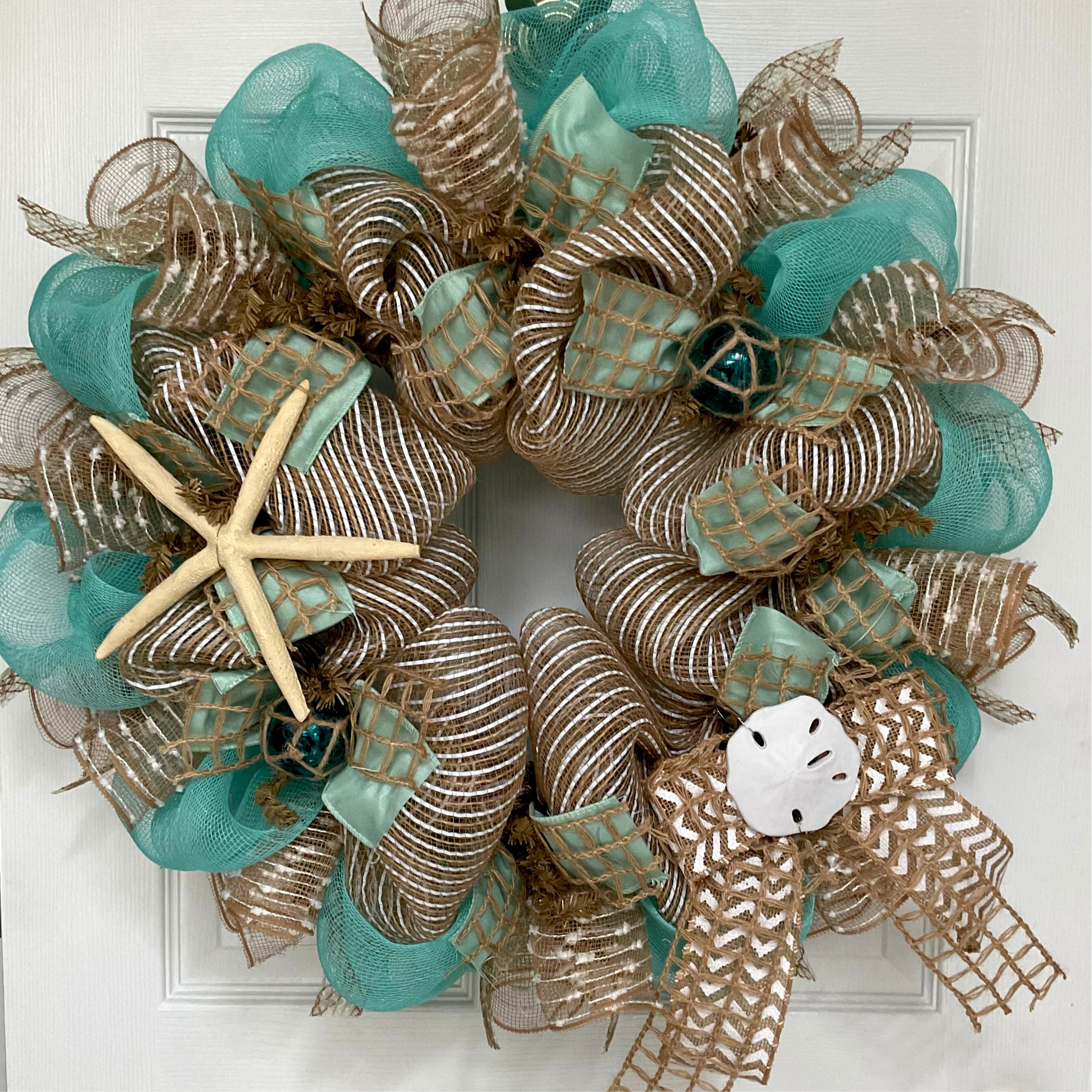 https://assets.wfcdn.com/im/96780053/compr-r85/2101/210122962/beach-wreath-with-nautical-balls-24-inches-indooroutdoor-handmade-deco-mesh.jpg