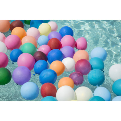 Balloons Floating In A Swimming Pool by Emptyclouds - Wrapped Canvas Print