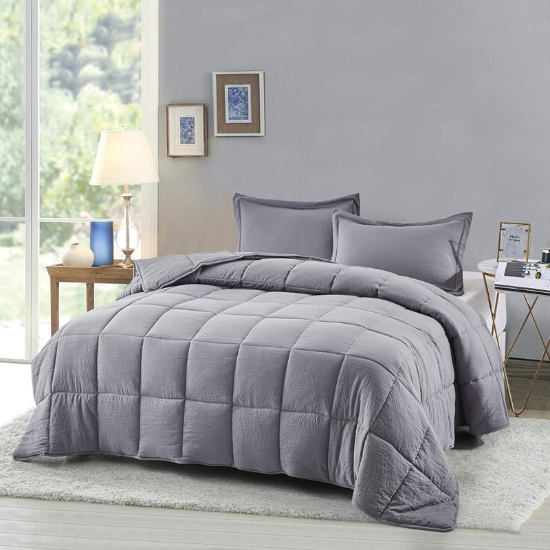 Ensemble de couette en fibres synthÃ©tiques prÃ©lavÃ©es, format simple - Motif chic rÃ©versible - Piquage en carreaux avec 4 pattes aux coins - LÃ©gÃ¨re, pour toutes les saisons - Couette bleue avec 2 taies d'oreiller