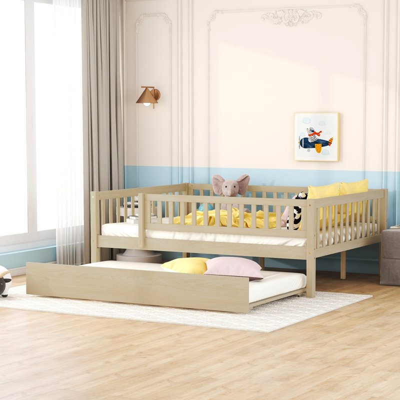 Full Size Daybed With Trundle And Secure Fence Guardrails In Natural Wood. Ensures A Restful Night. Space Optimization. No Box Spring Required Size Wood Guardrails. Improves Bedroom Practicality.