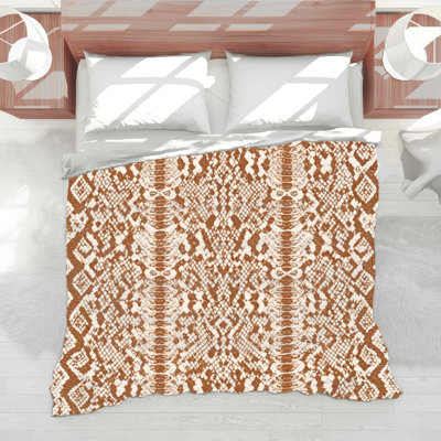 Couette à motif peau de serpent
