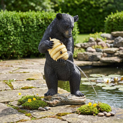 Statue de ruche et d'ours noir