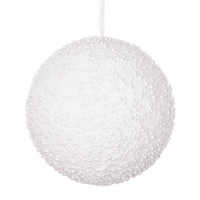 White Pearl Ball Ornament. This ornament is covered with white beads with a pearly appearance. It measures 10 inches wide. Includes one ornament.