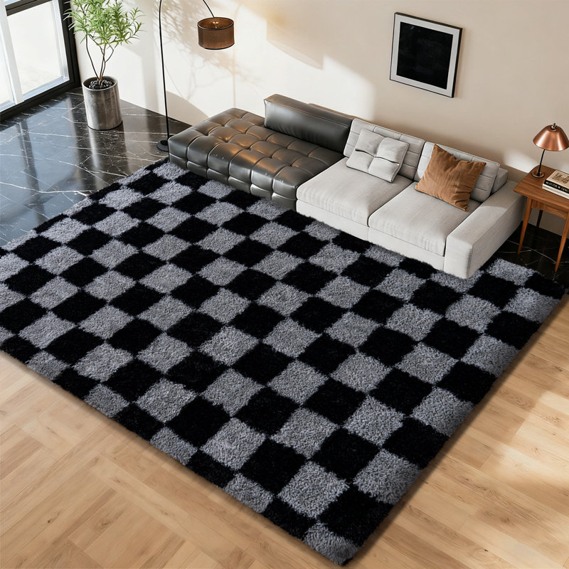 Black and gray checkered area rug with an ultra-soft, non-slip backing, suitable for living rooms, bedrooms, and nurseries.