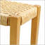 Banc extérieur sans dossier en bois d'acacia durable et siège en faux rotin Angie, parfait pour la terrasse et le jardin