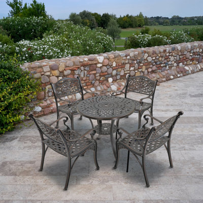 5 Piece Dining Set Round Cast-Top Table And Four Chair by clihome