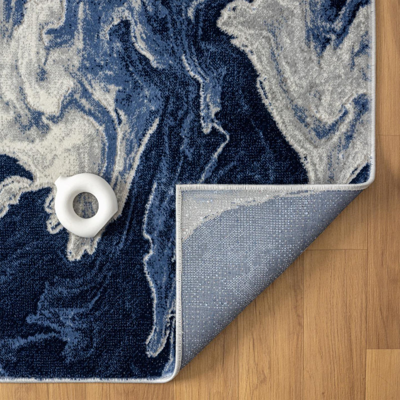 Tapis abstrait bleu en polypropylène tissé à la machine Jacleen, Rectangle 5 pi 1 po x 7 pi 4 po