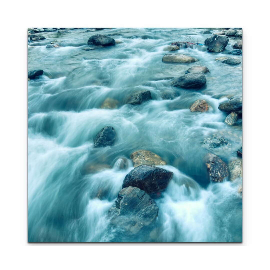 Leinwandbild Flussströmung zwischen Steinen