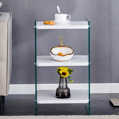 Three-tier bedside table: mdf top with white stickers, transparent tempered glass sides, simple design with storage (112 characters)