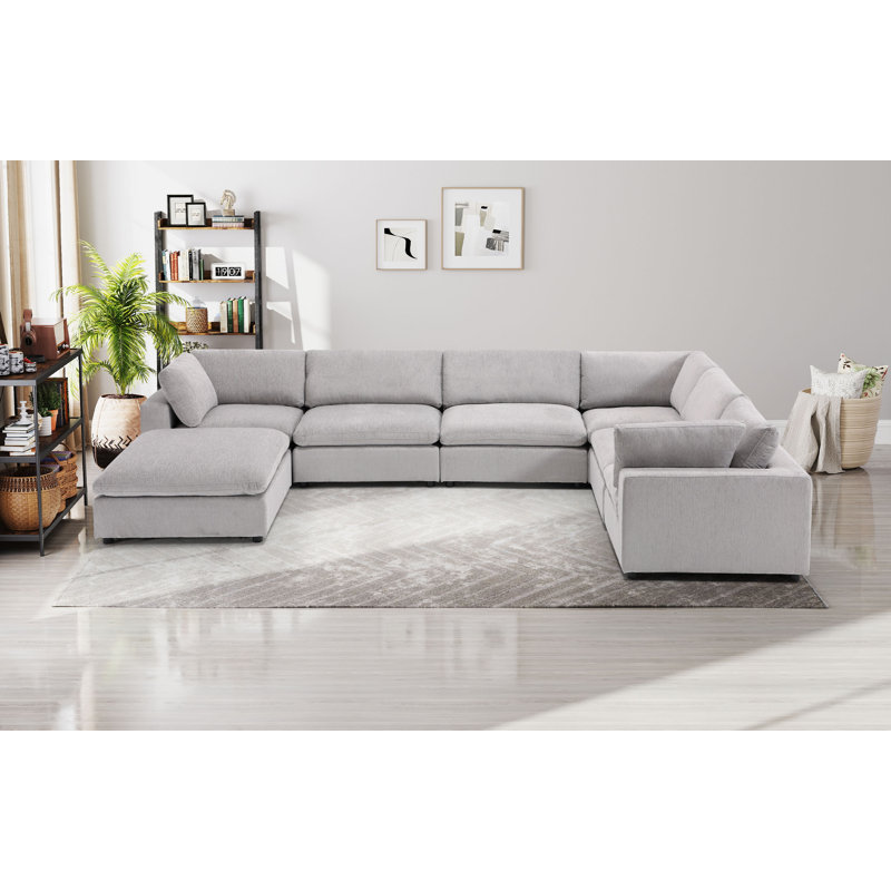 Canapé modulaire rembourré avec repose-pieds 7 pièces Nuccio, Gris clair
