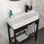 Lavabo console en céramique d'inspiration rétro 28 po x 12 po avec planche à laver intégrée, trop-plein et pieds noirs élégants