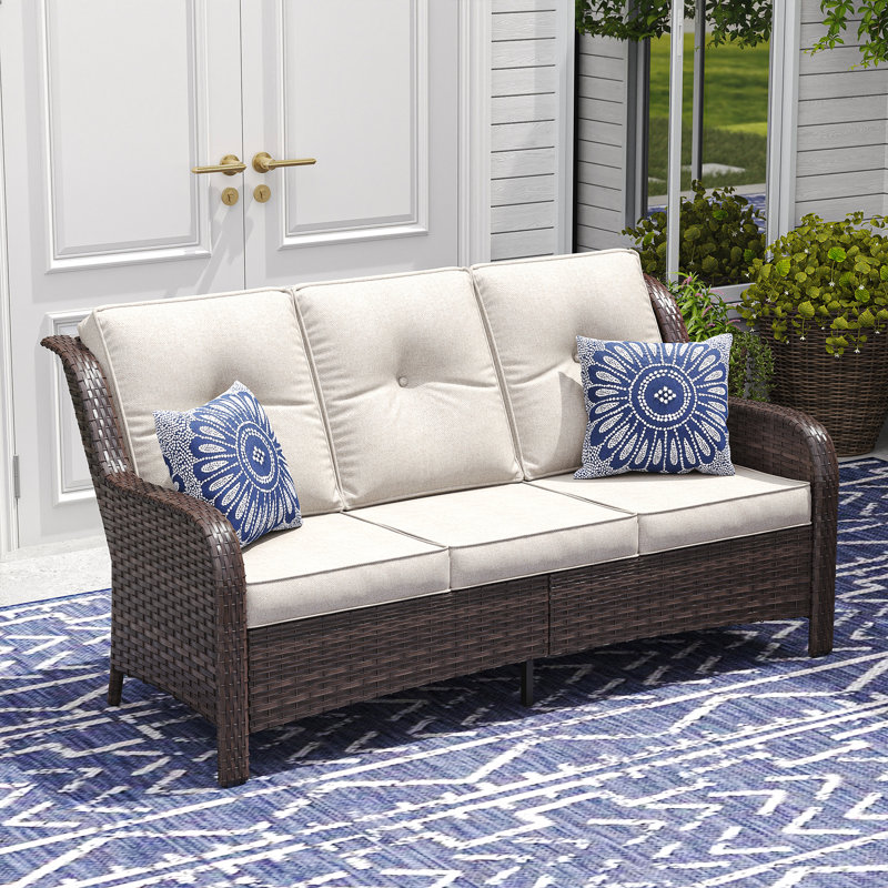 Élégant canapé d'extérieur en rotin tissé, Coussin beige / structure brune