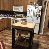 Behling Solid Butcher Block Kitchen Island with Baskets and Storage Shelf