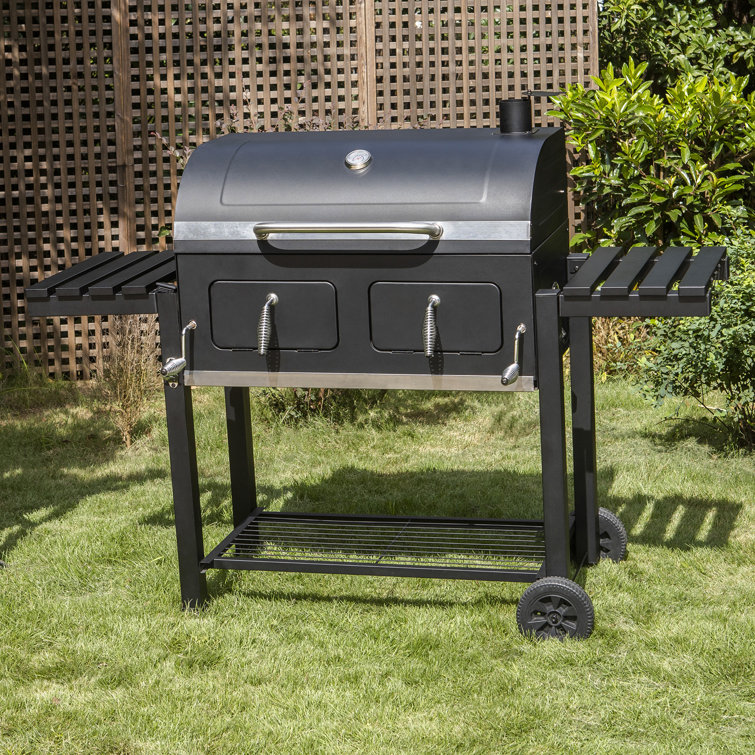 https://assets.wfcdn.com/im/96991054/resize-h755-w755%5Ecompr-r85/2590/259022960/34%22+Barrel+Charcoal+Grill+with+Two+Individual+Liftable+Charcoal+Trays+to+Achieve+Dual+Zone+Cooking.jpg