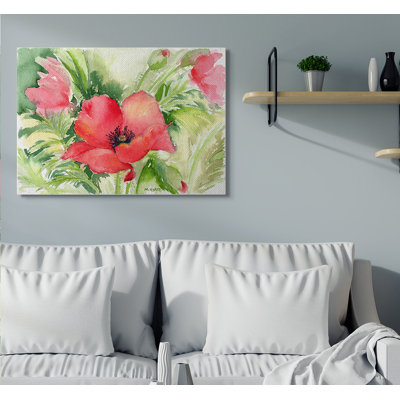 Coquelicots rouges entourés de verdure douce