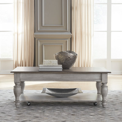 Cassady 48" W Solid Wood Cocktail Table with Casters