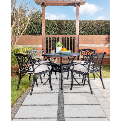 Fowles 4 - Person Patio Dining Set with Round Table , Cushions Included